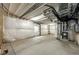 Unfinished basement with vapor barrier, concrete floors, and utility connections at 469 S Olathe St, Aurora, CO 80017
