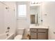 Clean bathroom with a shower-tub combination, neutral-toned vanity, and a large mirror at 469 S Olathe St, Aurora, CO 80017