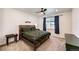 Bedroom with wood frame bed, ceiling fan, and natural light at 469 S Olathe St, Aurora, CO 80017