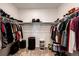 Walk-in closet offering ample storage with shelving and hanging space for clothes and accessories at 469 S Olathe St, Aurora, CO 80017