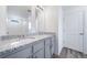 Stylish bathroom boasts a double sink vanity with granite countertop and modern fixtures at 22133 E 38Th Pl, Aurora, CO 80019