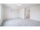 Bright bedroom with two windows and neutral carpet, offering a comfortable living space at 22133 E 38Th Pl, Aurora, CO 80019
