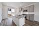 Modern kitchen with a granite island, stainless steel appliances, and open floor plan at 22133 E 38Th Pl, Aurora, CO 80019