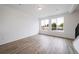Bright room with wood floors, two large windows, and lots of light at 22133 E 38Th Pl, Aurora, CO 80019