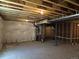 Unfinished basement with wrapped walls, exposed ceiling, and mechanical components at 418 Grey Rock St, Brighton, CO 80601