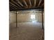 Unfinished basement view featuring exposed ceiling, a window, and support columns at 418 Grey Rock St, Brighton, CO 80601