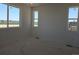 Bright bedroom with three large windows that provide lots of natural light at 418 Grey Rock St, Brighton, CO 80601