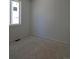 Clean and simple bedroom with bright windows and fresh paint, ready to be personalized at 418 Grey Rock St, Brighton, CO 80601