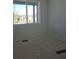 A bright bedroom featuring a large window that provides lots of natural light at 418 Grey Rock St, Brighton, CO 80601