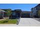Beautiful modern home featuring stone accents, a two-car garage, and professionally landscaped front yard at 418 Grey Rock St, Brighton, CO 80601