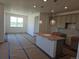 Spacious kitchen with pendant lighting, an island, and modern cabinets at 418 Grey Rock St, Brighton, CO 80601