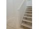 Close-up of an unfinished staircase with white walls at 418 Grey Rock St, Brighton, CO 80601