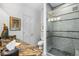 Modern bathroom featuring patterned granite countertops and a sleek glass enclosed shower at 400 S Steele St # 64, Denver, CO 80209