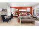 Bright bedroom featuring a statement red wall, sophisticated decor, and natural light at 400 S Steele St # 64, Denver, CO 80209