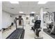 Well-equipped home gym featuring a treadmill, exercise bike, and various fitness machines at 400 S Steele St # 64, Denver, CO 80209