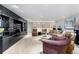 Spacious living room featuring carpeted floors, recessed lighting, and sleek black storage units at 400 S Steele St # 64, Denver, CO 80209