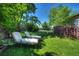 Lush backyard with green grass and lounge chairs, ideal for relaxation and enjoying the outdoors at 855 33Rd St, Boulder, CO 80303