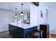 Bright kitchen features a large island with stylish pendant lighting and sleek countertops at 855 33Rd St, Boulder, CO 80303