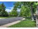 Picturesque street view with lush greenery and mountain views in the distance, creating a serene setting at 855 33Rd St, Boulder, CO 80303