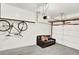 Attached garage space with couch and bicycle rack at 3030 W Prentice Ave # D, Littleton, CO 80123