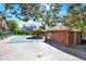 Community pool with shade structure and surrounding landscaping at 3030 W Prentice Ave # D, Littleton, CO 80123