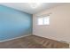 Comfortable bedroom with blue accent wall, carpet, and window to provide natural light at 12708 W Virginia Ave, Lakewood, CO 80228