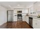 Modern kitchen featuring stainless steel appliances, including a refrigerator, range, and dishwasher at 12708 W Virginia Ave, Lakewood, CO 80228