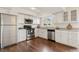 Well-maintained kitchen featuring stainless steel appliances and white cabinetry at 12708 W Virginia Ave, Lakewood, CO 80228
