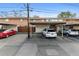 View of the parking area featuring covered parking spots and multiple vehicles at 12708 W Virginia Ave, Lakewood, CO 80228