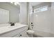 Bathroom with tile flooring, a tub and shower combo, and a white vanity at 2263 Serenidad St, Brighton, CO 80601