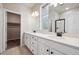 Bright bathroom with double vanity, modern fixtures, and tile floor at 2263 Serenidad St, Brighton, CO 80601