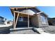 Modern home featuring mixed materials of siding, stone, and concrete front porch at 2263 Serenidad St, Brighton, CO 80601