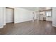 Spacious living room with lots of light, hardwood flooring, and open floor plan at 2263 Serenidad St, Brighton, CO 80601