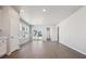 Spacious living room with natural light and wood-look flooring at 2263 Serenidad St, Brighton, CO 80601