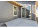 A concrete patio with a gray home exterior in the background at 2263 Serenidad St, Brighton, CO 80601