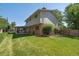 Expansive backyard with lush green lawn and covered patio, perfect for outdoor enjoyment at 7351 S Sheridan Ct, Littleton, CO 80128