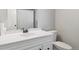 Clean, bright bathroom with a white vanity, modern sink, and shower with curtain at 7351 S Sheridan Ct, Littleton, CO 80128