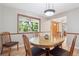 Inviting dining room with hardwood floors and natural light at 7351 S Sheridan Ct, Littleton, CO 80128