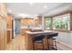 Kitchen features light wood cabinets, a gas cooktop, and a view of the backyard at 7351 S Sheridan Ct, Littleton, CO 80128