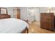 Spacious main bedroom with a dresser and ensuite bathroom at 7351 S Sheridan Ct, Littleton, CO 80128