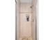 Beautifully tiled shower with a built-in niche for toiletries and modern fixtures at 7351 S Sheridan Ct, Littleton, CO 80128