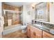 Bathroom featuring a tub and shower combination with granite countertops at 3 White Pelican Cir, Thornton, CO 80241