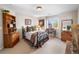 Comfortable bedroom with a cozy bed, natural light, and wood furniture at 3 White Pelican Cir, Thornton, CO 80241