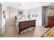 Bright bedroom featuring a cozy bed, natural light, and classic furniture at 3 White Pelican Cir, Thornton, CO 80241