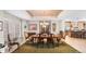 Open dining room features a view into the kitchen and large windows at 3 White Pelican Cir, Thornton, CO 80241