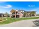 Stunning brick home features a two-story deck, manicured lawn, and inviting outdoor space at 3 White Pelican Cir, Thornton, CO 80241