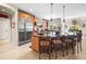 Open kitchen with stainless-steel appliances, island with seating and granite countertops at 3 White Pelican Cir, Thornton, CO 80241