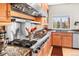 Bright kitchen with granite countertops, professional range and stainless-steel appliances at 3 White Pelican Cir, Thornton, CO 80241