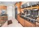 Gourmet kitchen featuring stainless steel appliances, professional range and custom cabinetry at 3 White Pelican Cir, Thornton, CO 80241