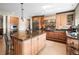 Spacious kitchen with stainless steel appliances, large island and granite countertops at 3 White Pelican Cir, Thornton, CO 80241